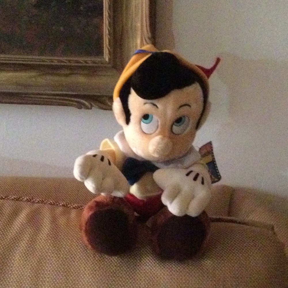 10” long. Sitting Pinocchio. New with tag.Vintage
